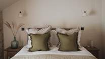 With a cosy king size bed in organic inflections 