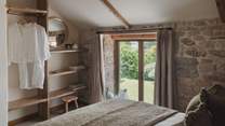 With hanging space at the far side of the room