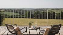 Outside, chairs can be found on the balcony, inviting lingering spells from hazy dawns to star-kissed nights