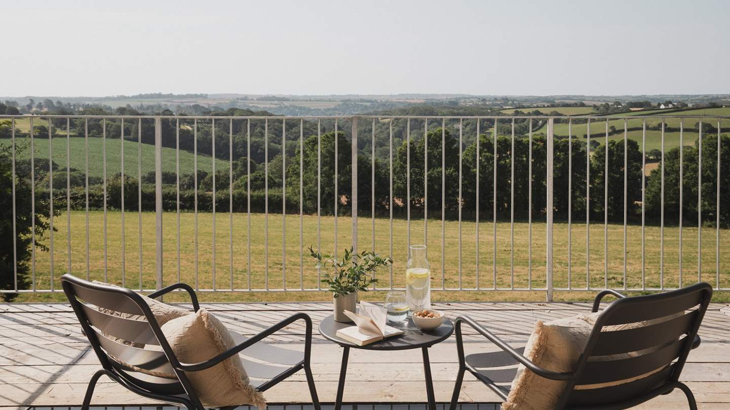 Outside, chairs can be found on the balcony, inviting lingering spells from hazy dawns to star-kissed nights