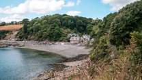 Explore the enchanting landscapes through coast path strolls to postcard pretty Durgan