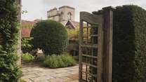 Discover the patio framed by curated yew trees