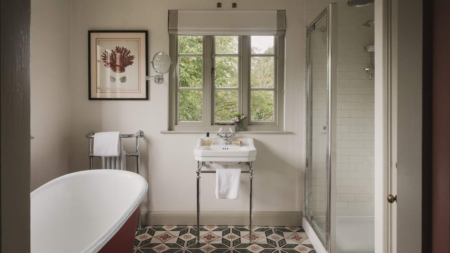 A free-standing bathtub promises slow mornings and soothing evening soaks