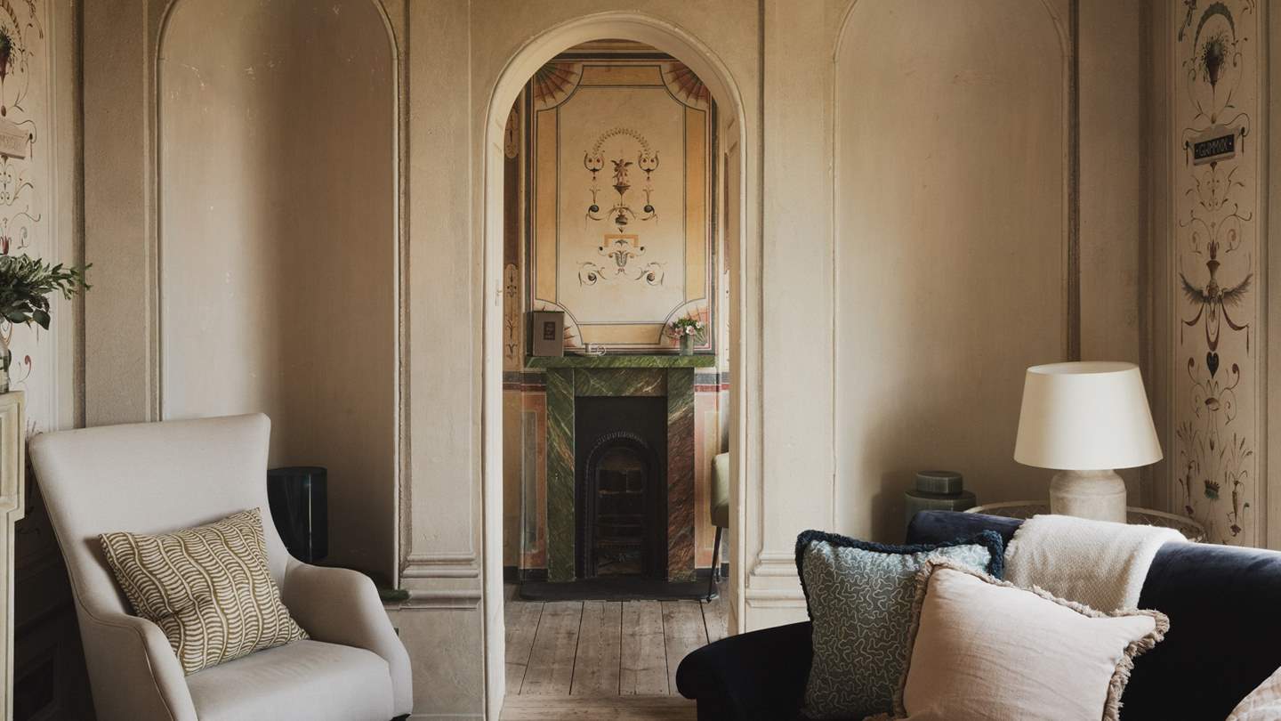 Elegant arches and delicate flourishes adorn the neutral-toned space