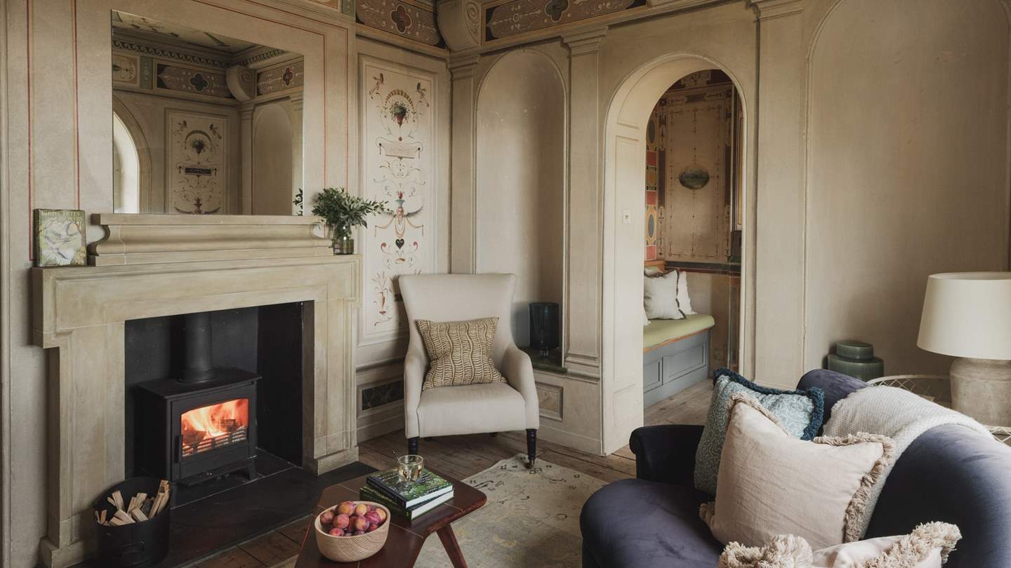 Sink onto the velvety sofa for evenings of calm beside the wood-burning stove