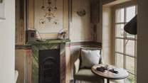 Lose time beside verdant vistas in the cosy reading nook