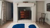 For storing belongings, there is a Mahogany chest of drawers and storage cupboards