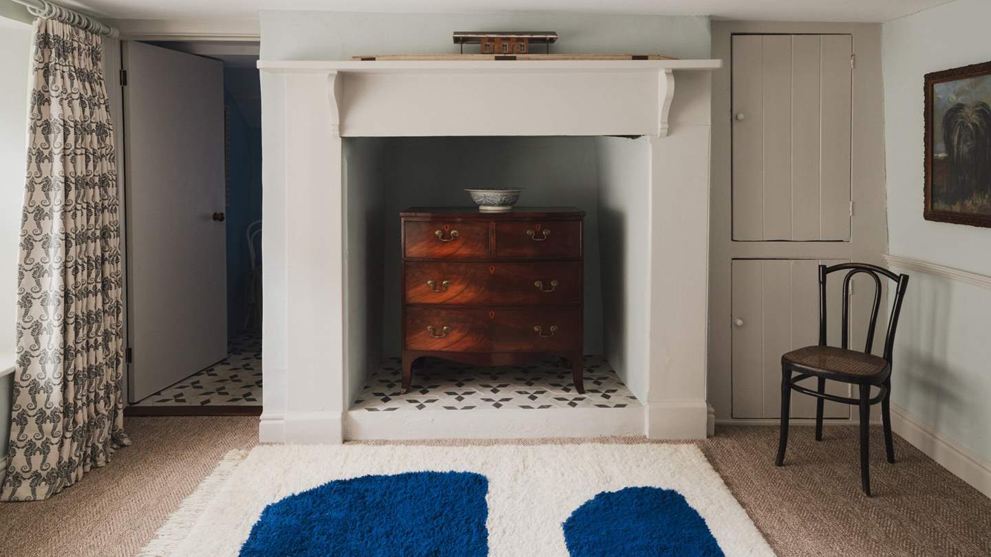 For storing belongings, there is a Mahogany chest of drawers and storage cupboards