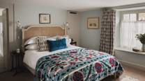 This heavenly space promises heirloom antique furniture and jute carpet underfoot