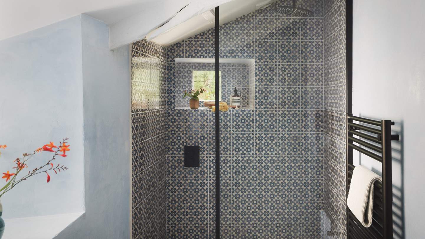 You'll also find a spacious walk-in rainfall shower