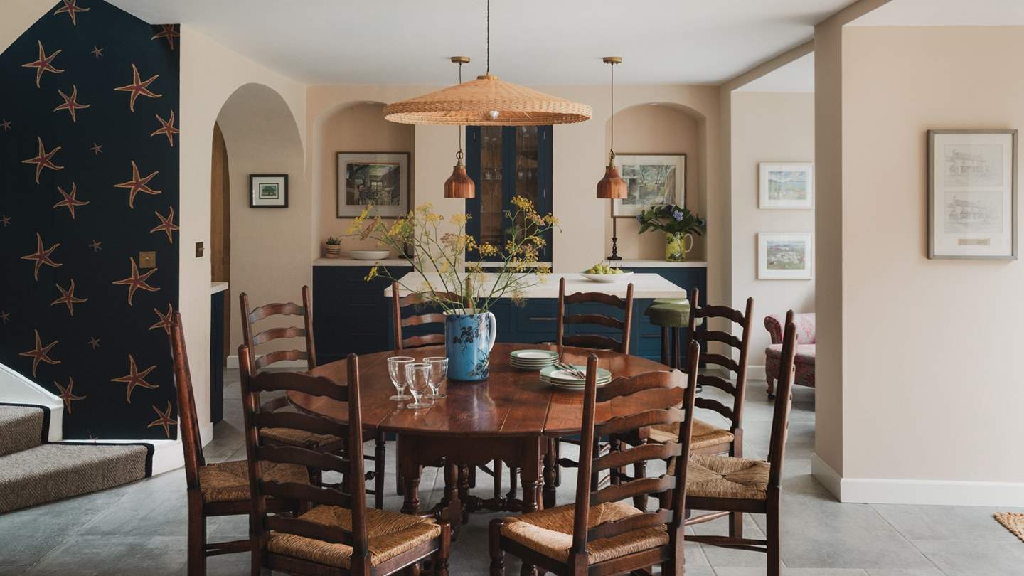 Savour mealtimes around the round oak dining table, seating ten guests for both leisurely breakfasts and celebratory feasts beside expansive windows
