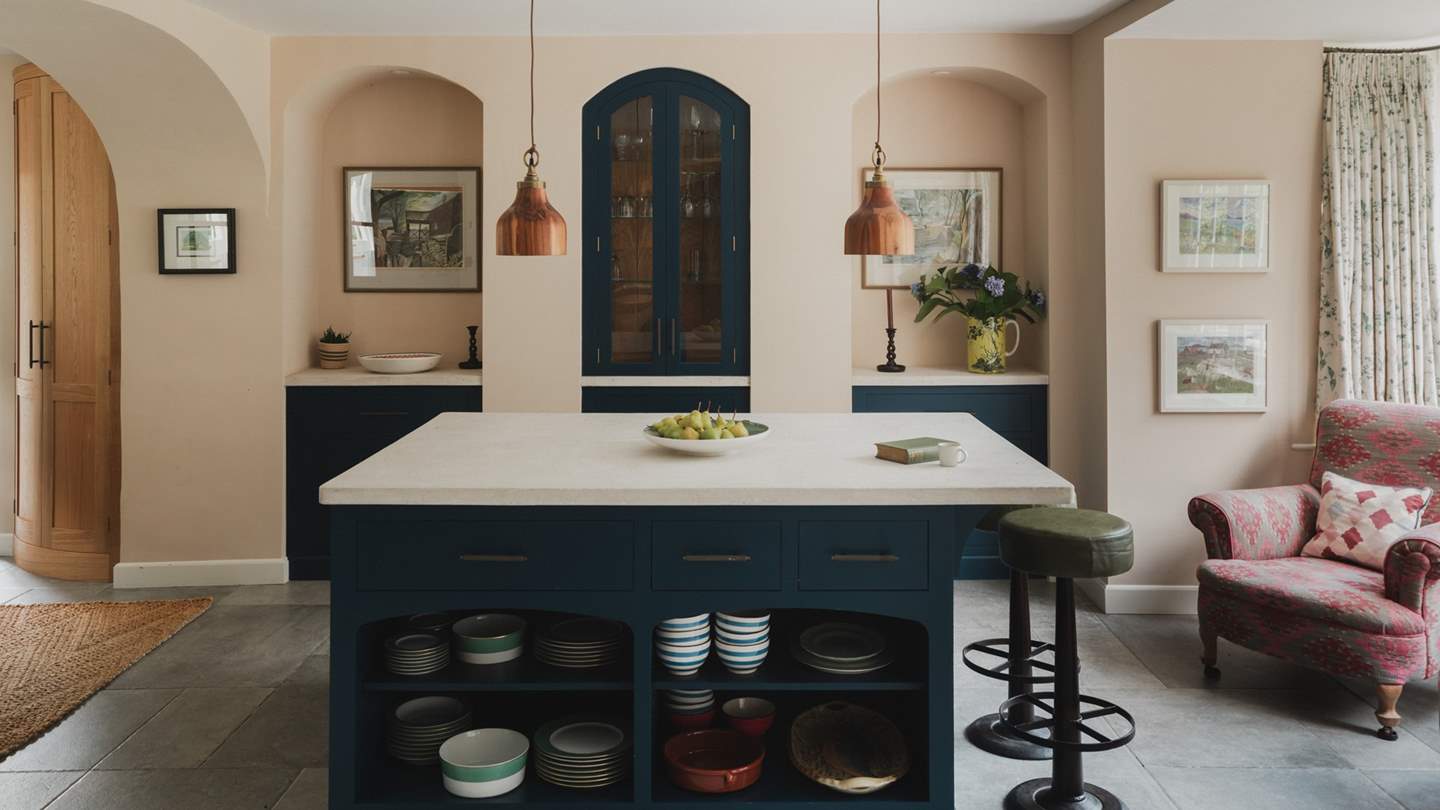 Blending whimsy with quintessential English charm, the bespoke kitchen is both practical and beautiful