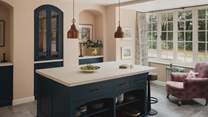 A statement island invites guests to gather for culinary creation in the kitchen