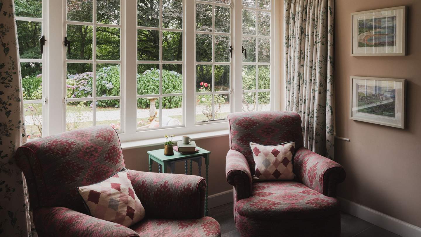 Heavenly garden views unfurl beyond the beautiful original windows
