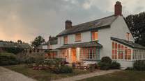Escape to our elegant country farmhouse near the coast of Bude, Cornwall, welcoming ten guests for a dreamy rural retreat - and it's dog-friendly too...