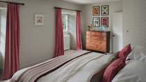 You’ll also find a wooden chest of drawers, two bedside tables and a rail for storing belongings.