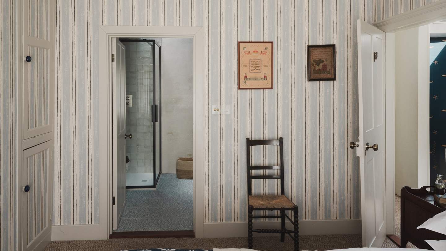 Contemporary Tadelakt walls ensure a stylish place for self-care in the ensuite, complete with a rainfall shower