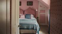 Styled in flamboyant candy pink shades with blue inflections, ‘Ikat’ is a darling space to unwind