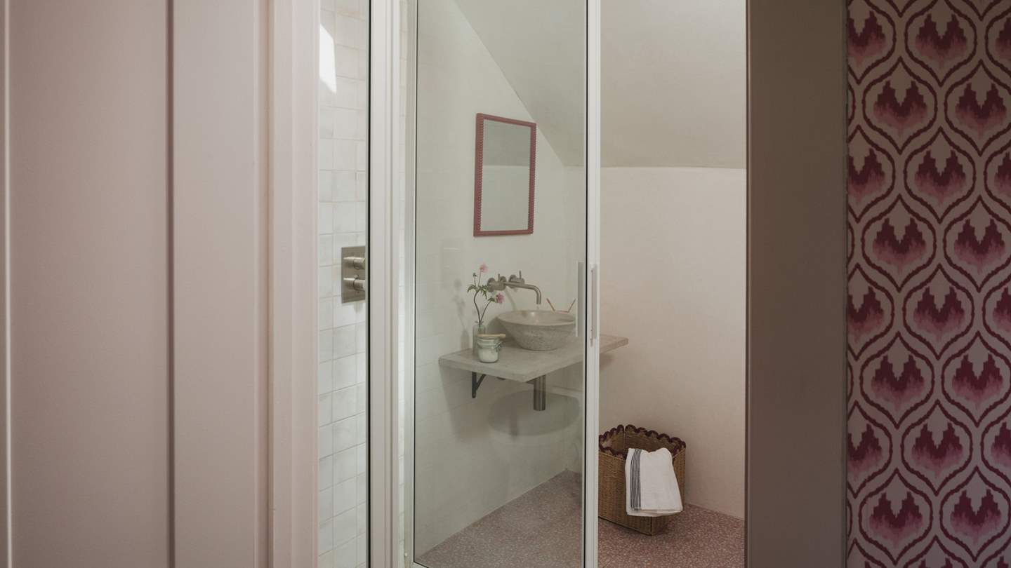 In the ensuite you’ll find stunning terrazzo-style floor tiles and a walk-in shower