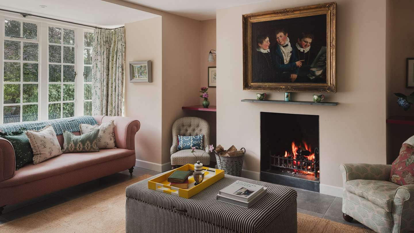 Gather beside the open fire in the formal living room