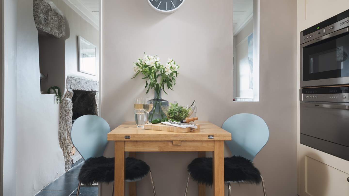 The bijou kitchen for two, complete with dining table for intimate meals...