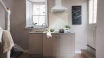 The cute kitchen is equipped with everything you'll need to rustle up feasts
