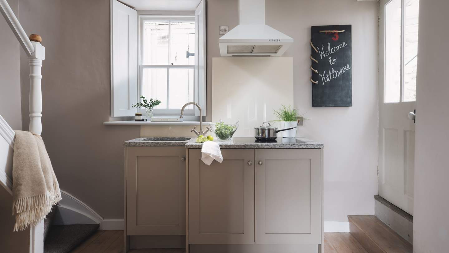 The cute kitchen is equipped with everything you'll need to rustle up feasts