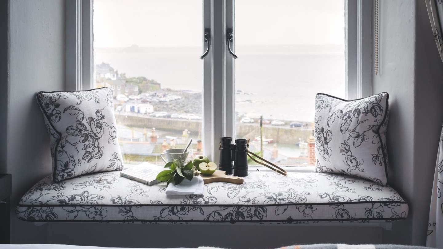 Slow mornings are all about watching the hubbub in Mousehole harbour from the comfort of bed...