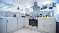 The charming cottage kitchen is fully equipped with top of the range appliances including a Nespresso coffee machine