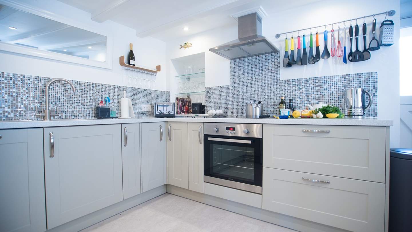 The charming cottage kitchen is fully equipped with top of the range appliances including a Nespresso coffee machine