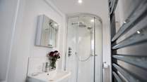 The en-suite has a luxurious shower after a long day at the beach