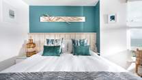 The master bedroom with a sumptuous king size bed, promising dreamy mornings enjoying the magical views across St Ives