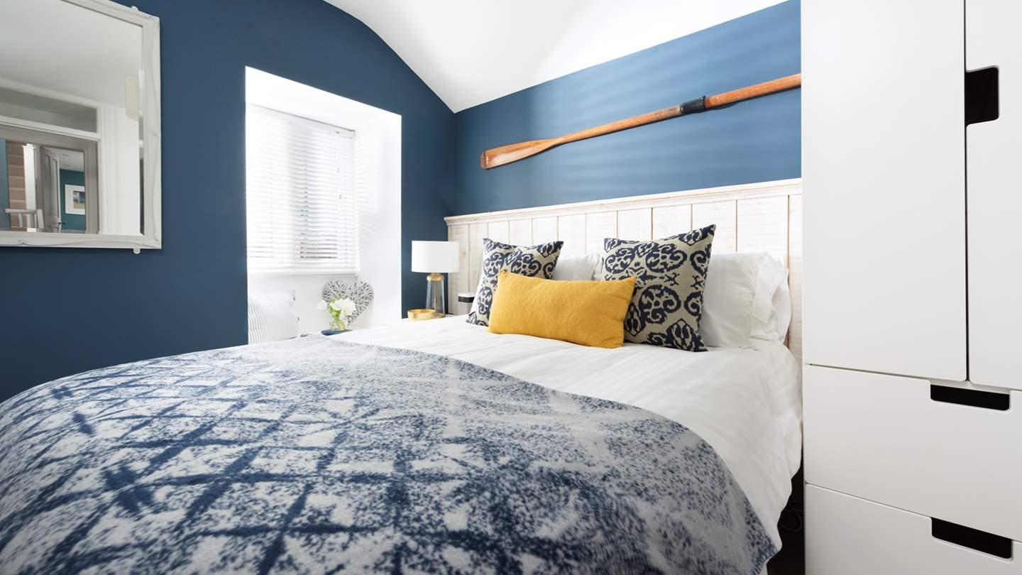 The third bedroom tucked away at the rear of the house welcomes peaceful slumbers 