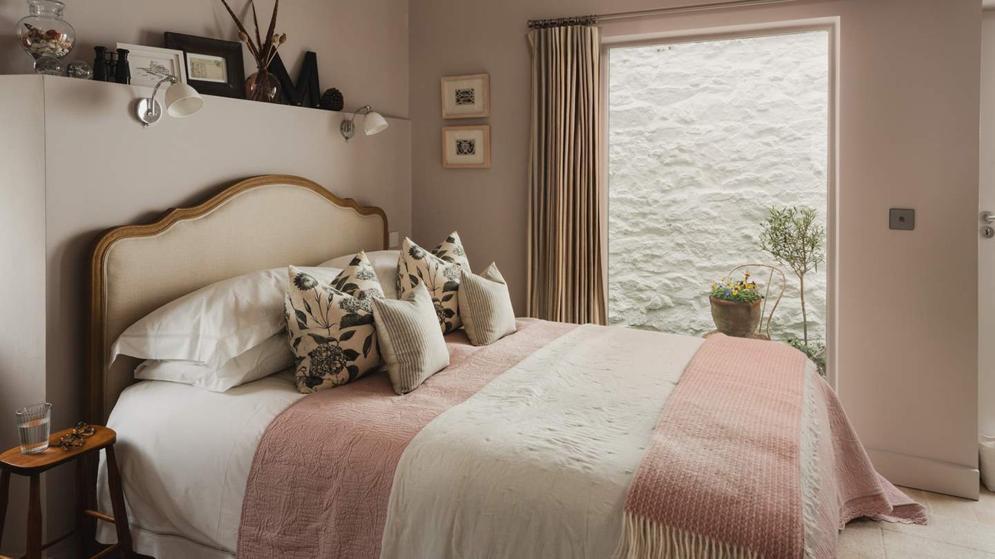 The bedroom doors lead out to a wonderful little courtyard area