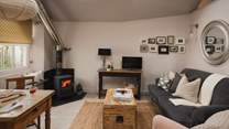 Enjoy moments of relaxation beside the oh-so-cosy wood burner