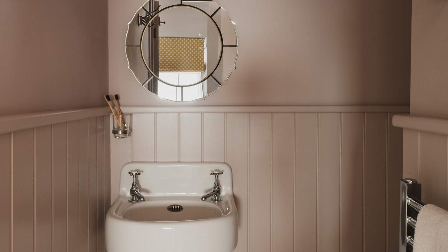 The separate washroom is tucked away to the left of the bedroom