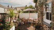 The outdoor area is enveloped in famous Cotswold stone