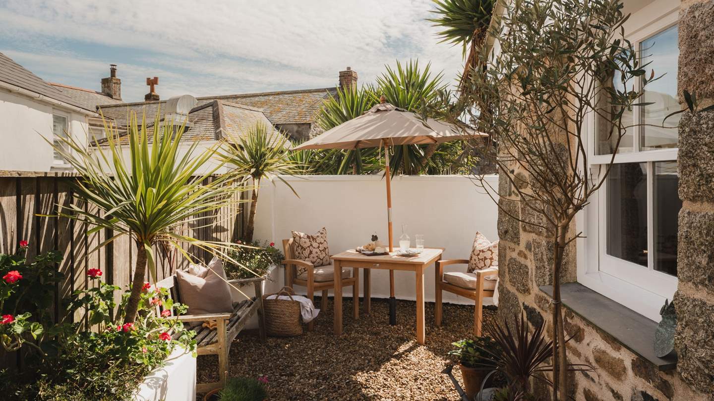 Heading outside, find an idyllic courtyard garden festooned with palm fronds, perfect for Champagne toasts in the salted air