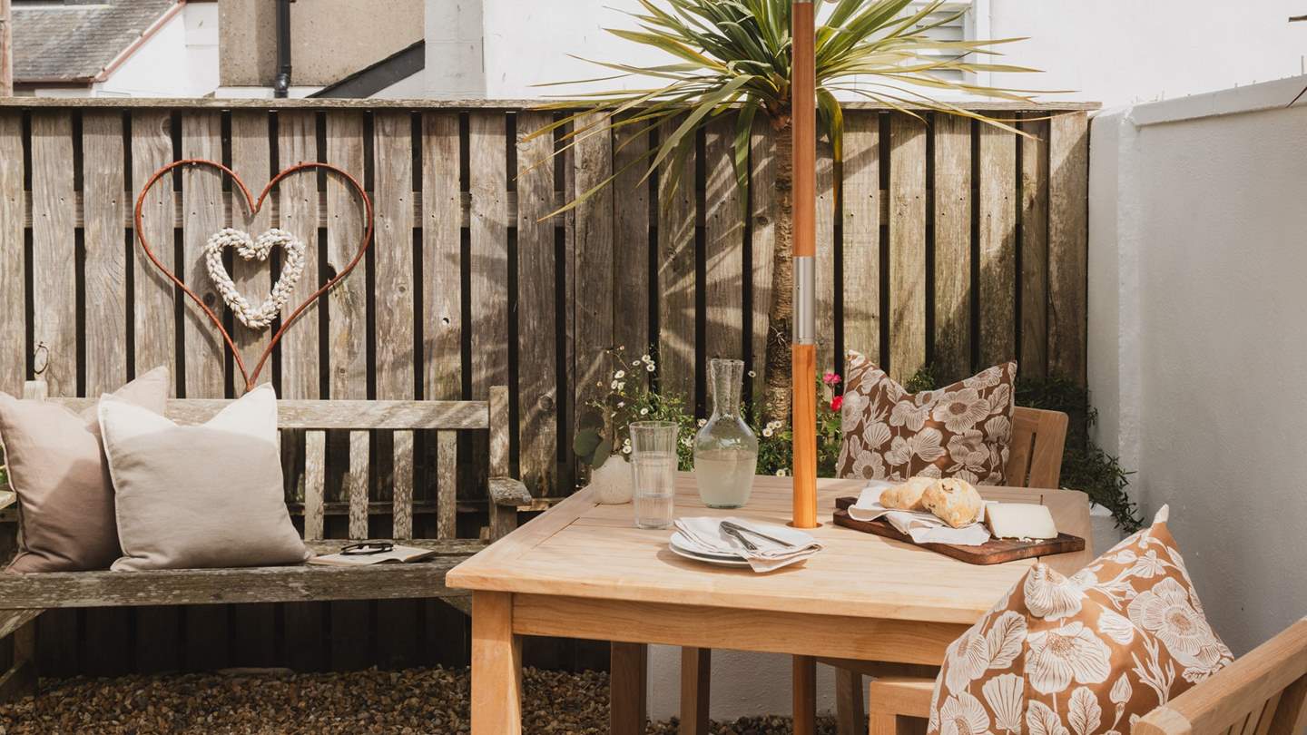 Balmy summer days drift by sweetly beneath the shade of the parasol