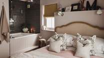 The gorgeous Japanese plunge bath is perfectly tucked in the corner of the bedroom