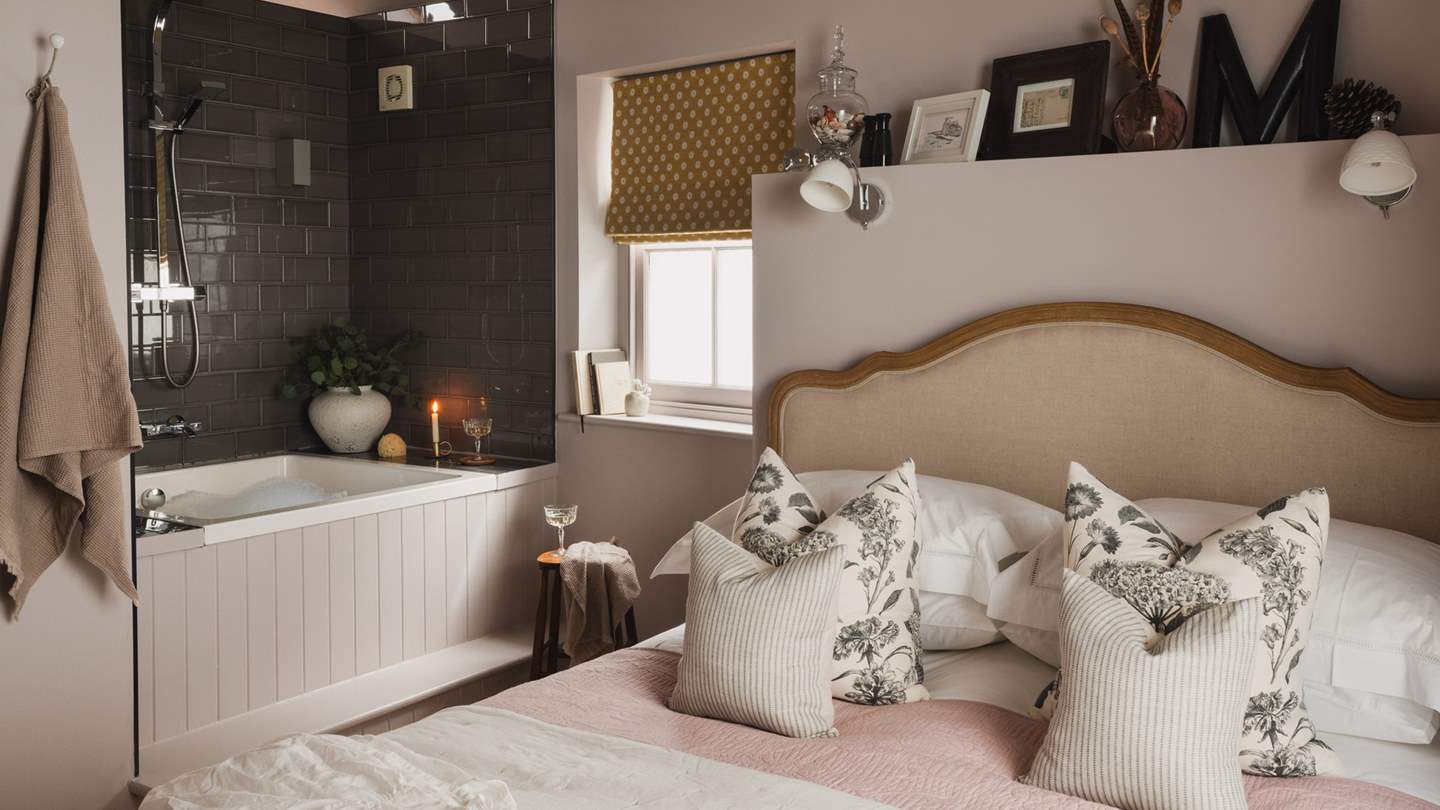 The gorgeous Japanese plunge bath is perfectly tucked in the corner of the bedroom