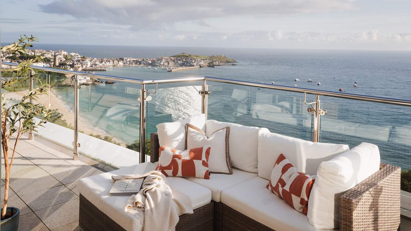 180-degree sea views can be enjoyed on the L-shaped outdoor sofa, from St Ives to Godrevy Lighthouse