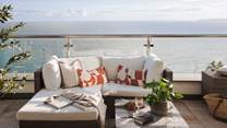 Admire the picturesque coastal scenes of gently swaying fishing boats from West Penthouse’s spacious balcony