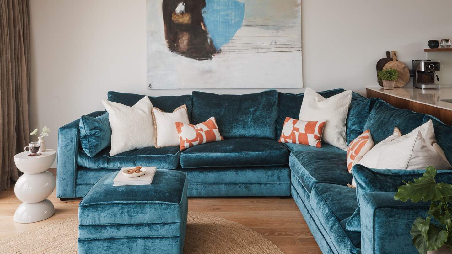 Taking centre stage is the sumptuous, teal-toned, velvet sofa by Duresta