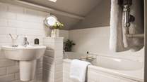 The elegant ensuite bathroom complete with luxurious Ren toiletries