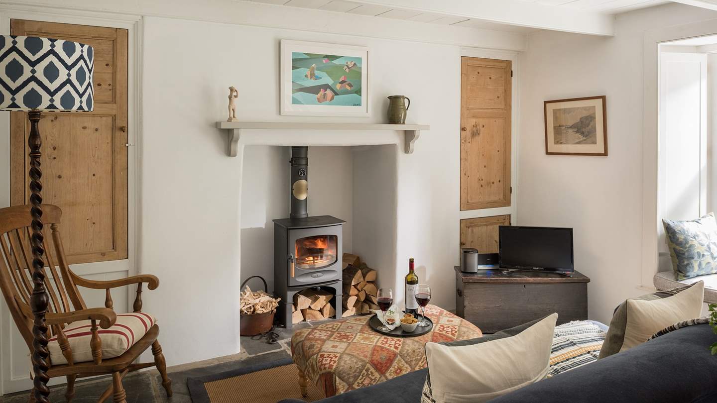 A gorgeous, airy room with beams, thick stone walls and fantastic artwork, the ideal spot with super-cosy underfloor heating and a delightful wood burning stove.