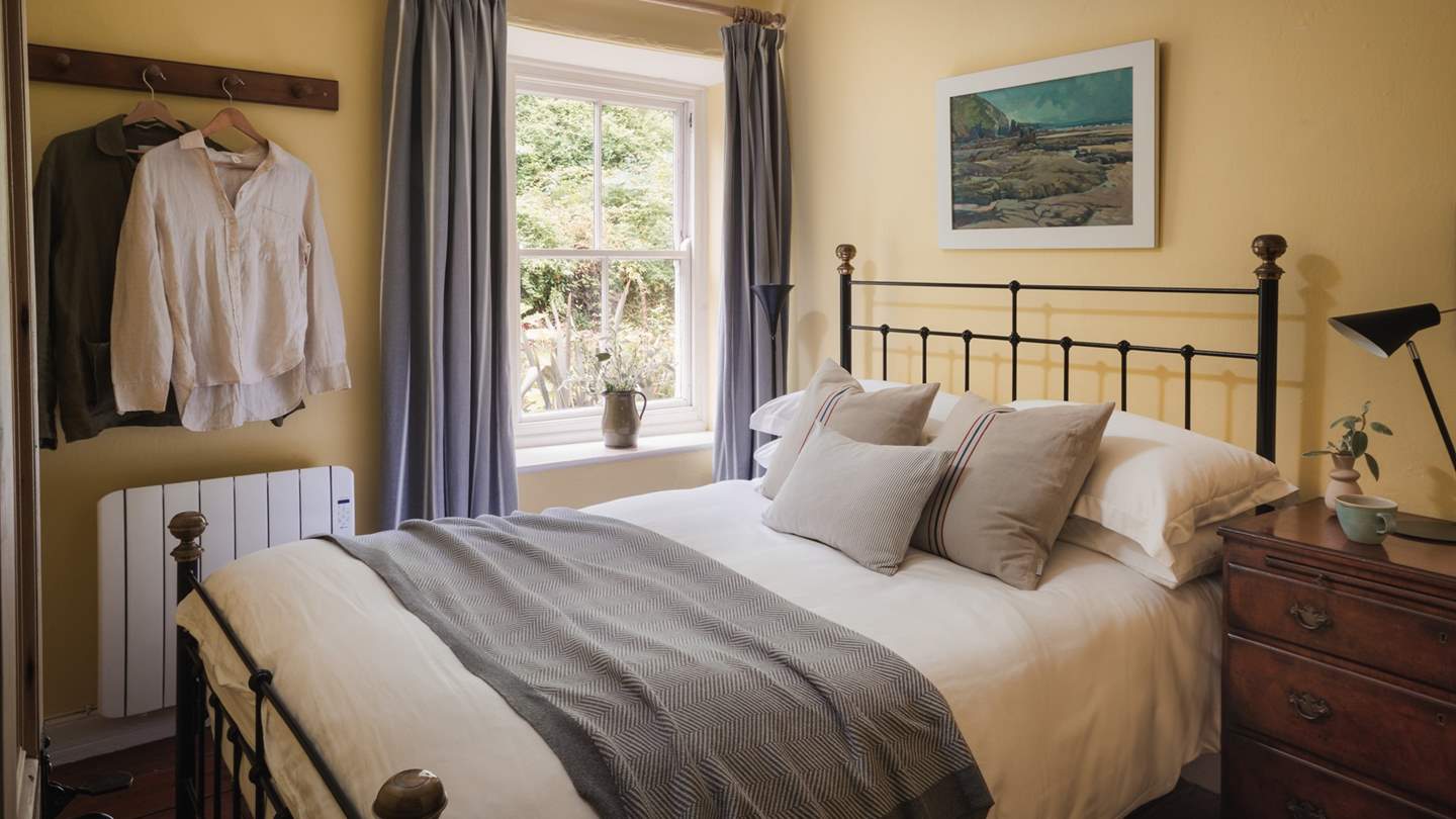 Warm and welcoming, the second bedroom is also found on the first floor and calls for restful nights and lingering lie-ins