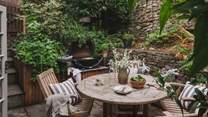 Step outside to the courtyard garden where an alfresco dining area awaits