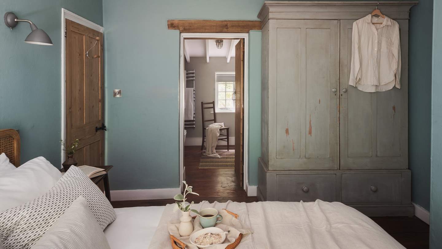 A spacious ensuite bathroom leads off from the bedroom