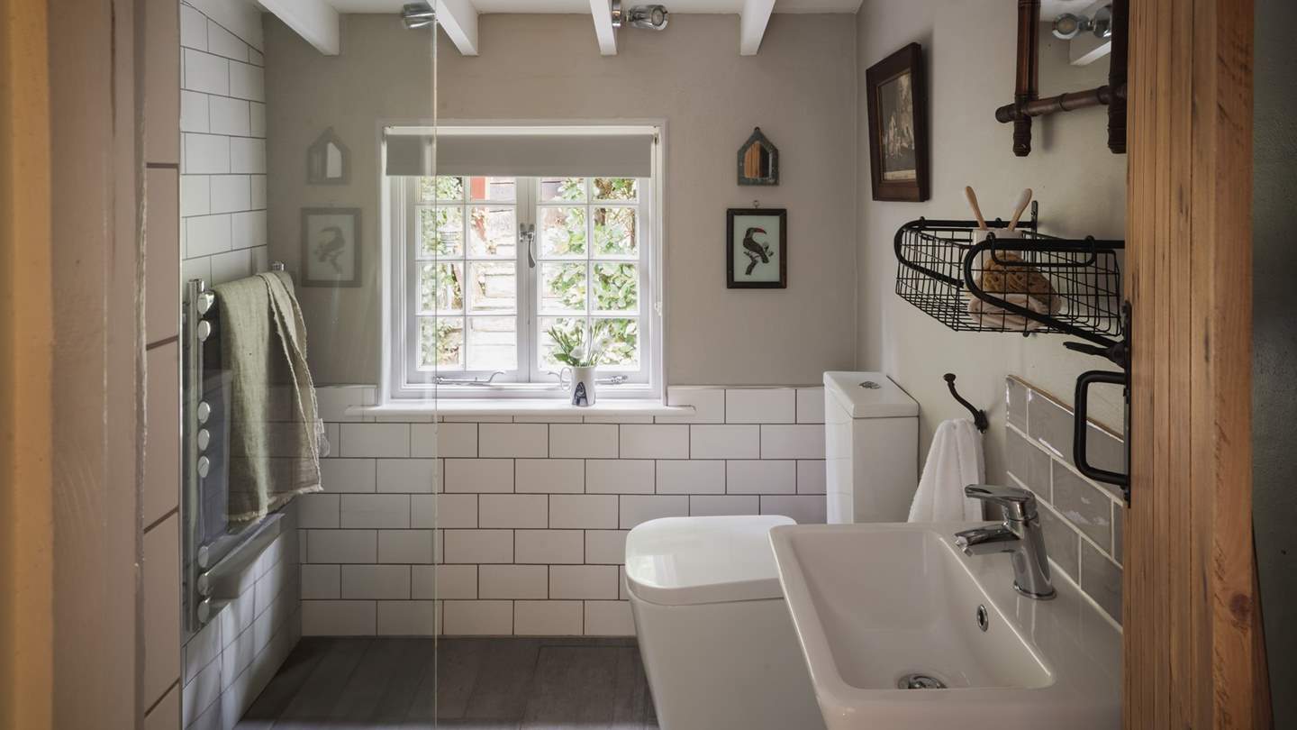 A second bathroom resides on the first floor with a walk-in shower
